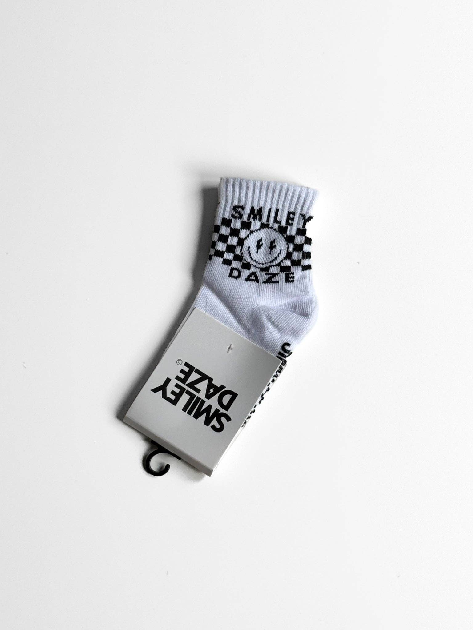 White sock with black checkered pattern and text on a white background
